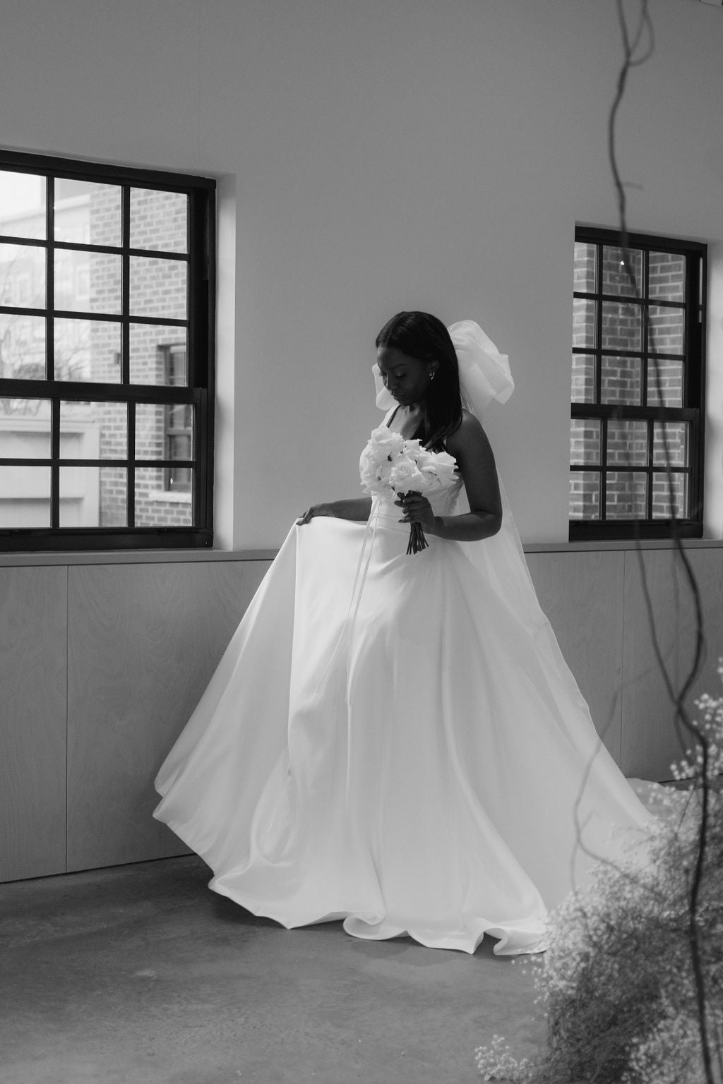 Bride wearing bow veil