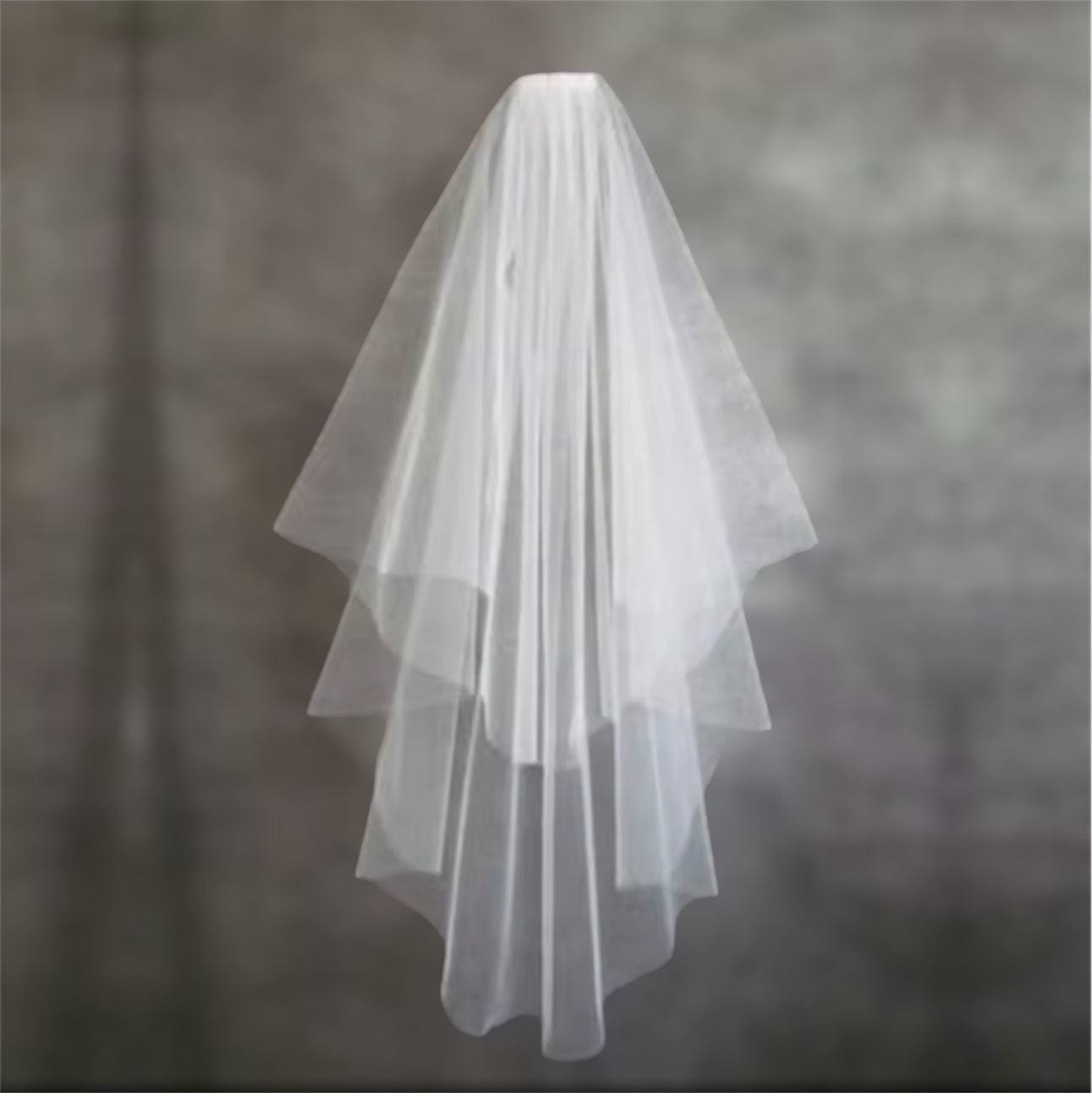 Fingertip length wedding veil with blusher