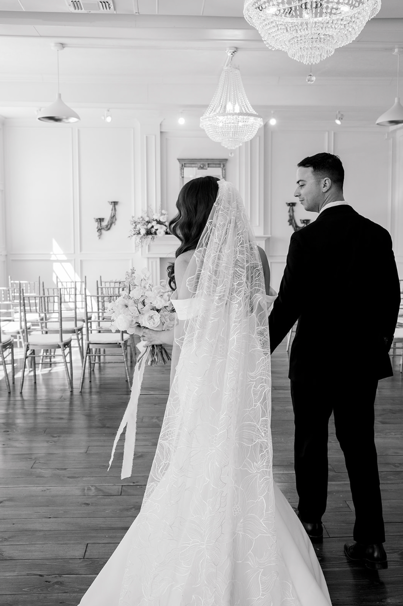 Bride wearing floral wedding veil