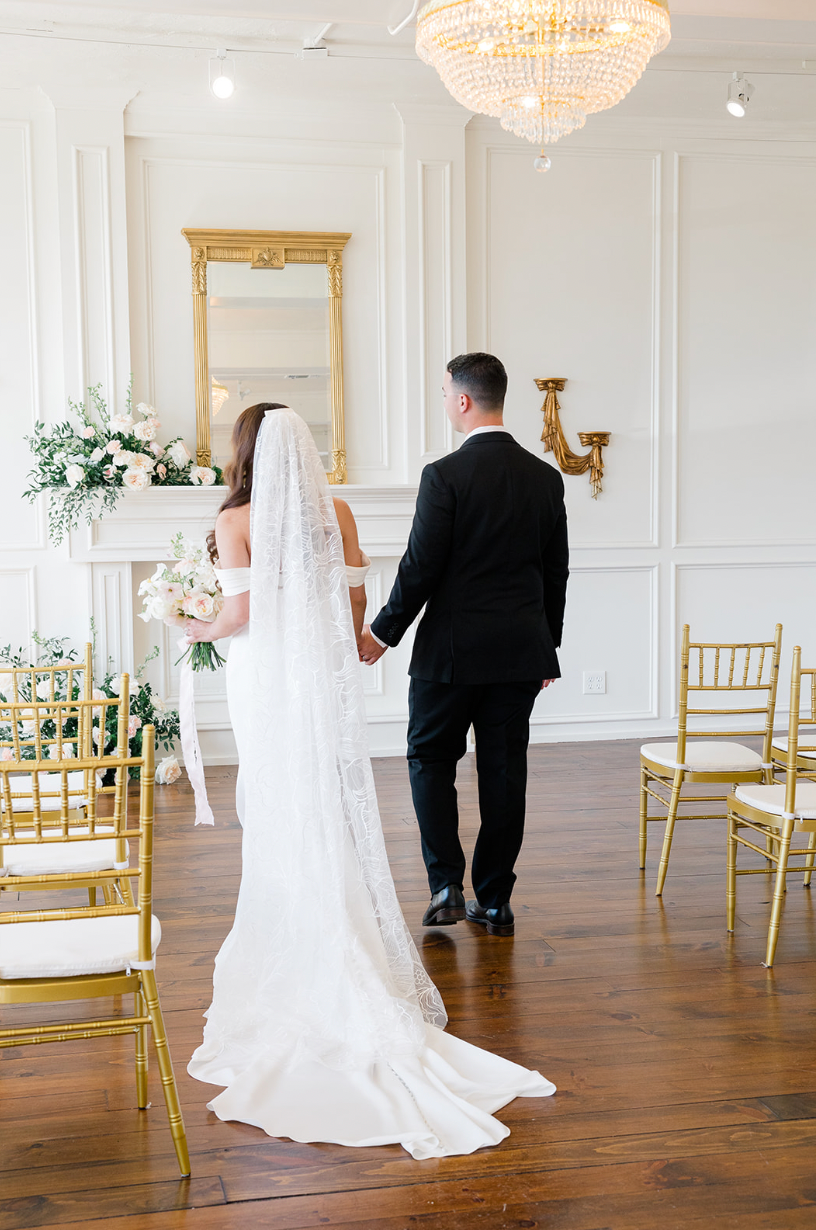 Bride wearing floral wedding veil