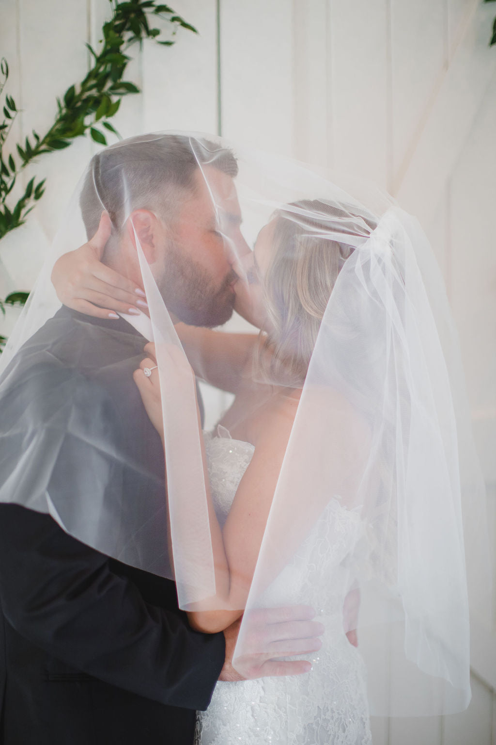 Fingertip length wedding veil with blusher